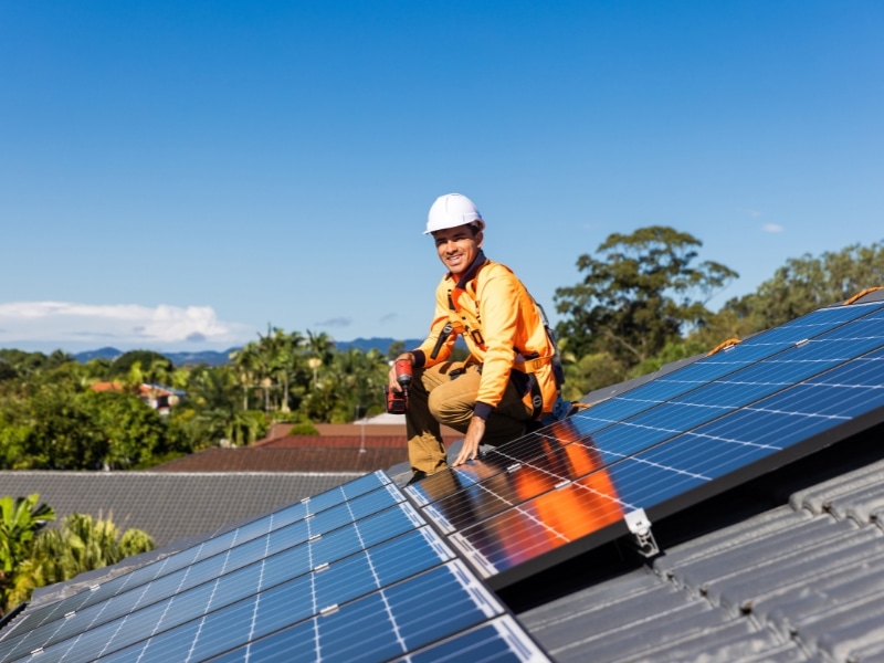 Cairns home solar system installer on a rooftop